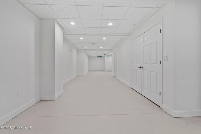 6004 Queen Mary Ct, Schenectady, NY 12303 - hall with recessed lighting, baseboards, a drop ceiling, and concrete floors