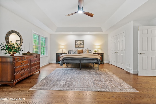 6004 Queen Mary Ct, Schenectady, NY 12303 - bedroom with a raised ceiling, dark wood-style floors, baseboards, and a closet