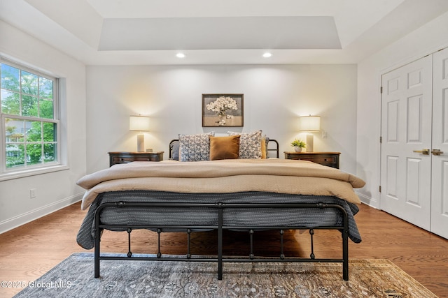6004 Queen Mary Ct, Schenectady, NY 12303 - bedroom with a raised ceiling, baseboards, wood finished floors, and recessed lighting