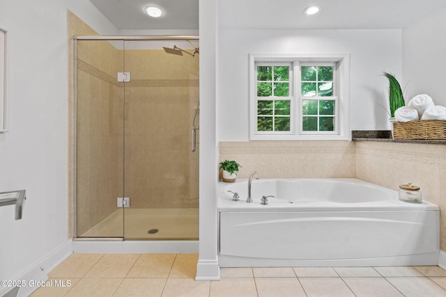 6004 Queen Mary Ct, Schenectady, NY 12303 - bathroom featuring a garden tub, tile patterned flooring, and a shower stall