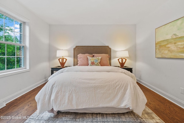 6004 Queen Mary Ct, Schenectady, NY 12303 - bedroom with multiple windows, wood finished floors, and baseboards