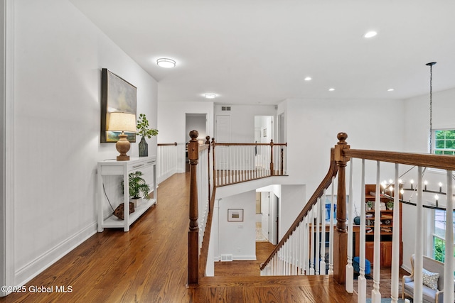 6004 Queen Mary Ct, Schenectady, NY 12303 - corridor featuring an upstairs landing, wood finished floors, baseboards, recessed lighting, and a chandelier