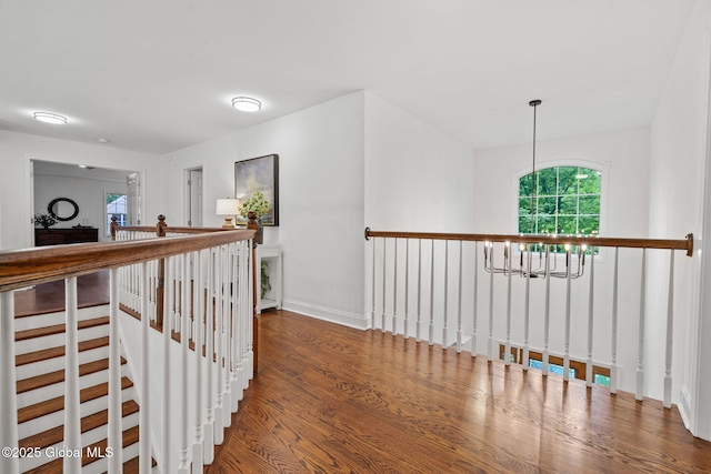 6004 Queen Mary Ct, Schenectady, NY 12303 - hall with a chandelier, wood finished floors, and an upstairs landing
