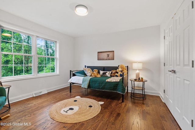 6004 Queen Mary Ct, Schenectady, NY 12303 - bedroom with a closet, wood finished floors, and baseboards