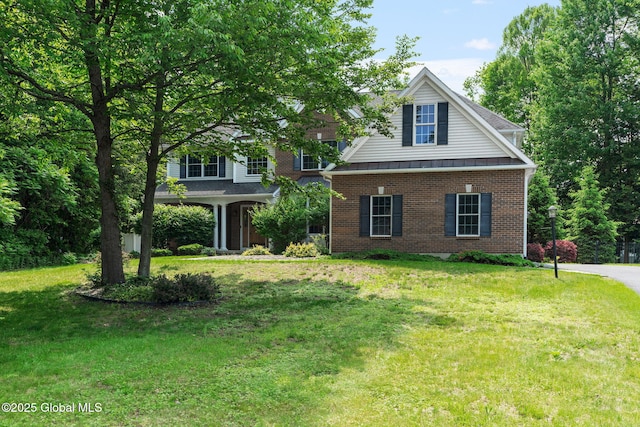 6004 Queen Mary Ct, Schenectady, NY 12303 - view of front of property with brick siding and a front yard