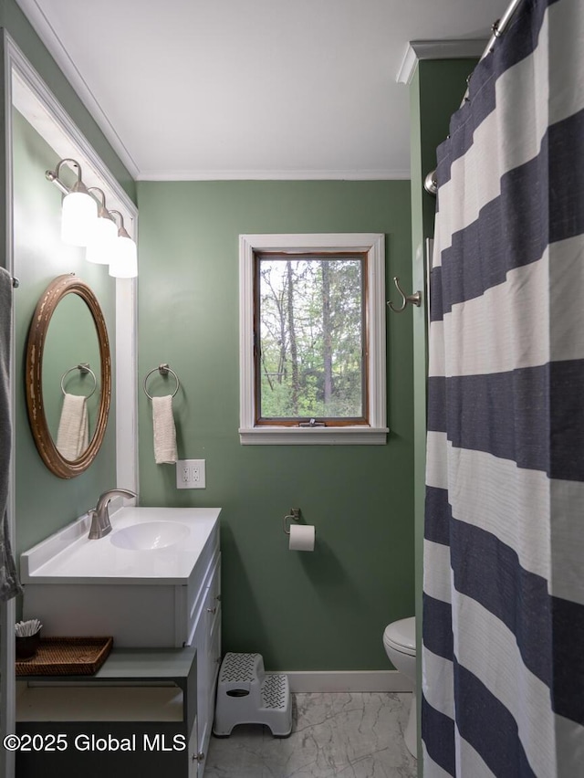 3 E St Stephens Ln, Glenville, NY 12302 - bathroom featuring marble look tile flooring, ornamental molding, vanity, toilet, and baseboards