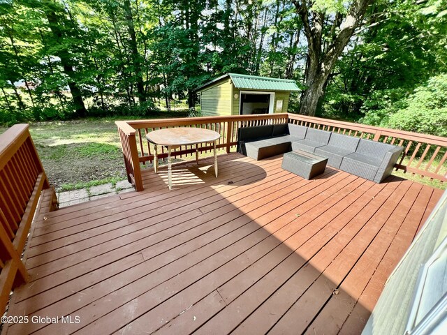 119 Houseman St, Mayfield, NY 12117 - wooden deck featuring an outbuilding and an outdoor living space