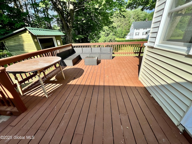 119 Houseman St, Mayfield, NY 12117 - wooden terrace featuring an outdoor hangout area and an outbuilding