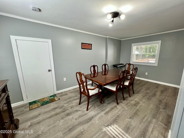119 Houseman St, Mayfield, NY 12117 - dining space with ornamental molding, light wood finished floors, and baseboards