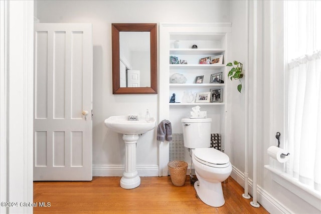 19 George St, Saratoga Springs, Inside, NY 12866 - half bathroom with toilet, wood finished floors, baseboards, and a sink