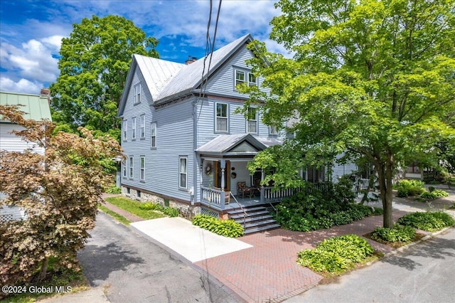 19 George St, Saratoga Springs, Inside, NY 12866 - view of front facade featuring a porch, metal roof, a standing seam roof, and a chimney