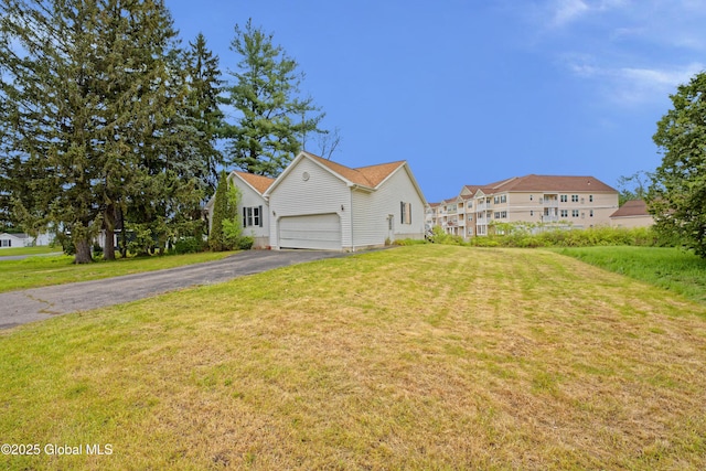 2188 Lynn St, Rotterdam, NY 12306 - view of home's exterior featuring driveway, a yard, and an attached garage