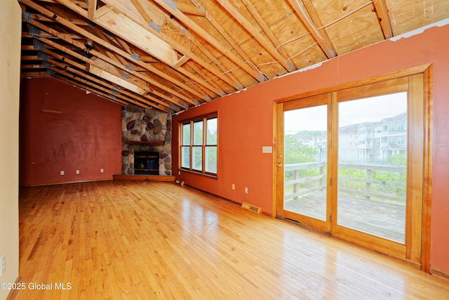 2188 Lynn St, Rotterdam, NY 12306 - unfurnished living room with vaulted ceiling, hardwood / wood-style floors, and a fireplace