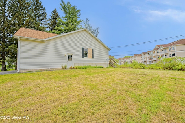 2188 Lynn St, Rotterdam, NY 12306 - view of home's exterior with a yard and roof with shingles