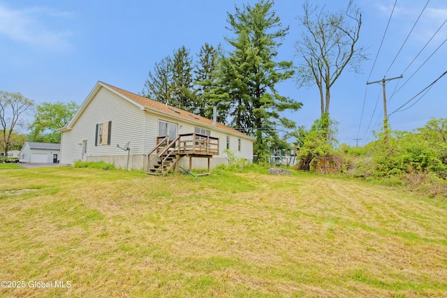 2188 Lynn St, Rotterdam, NY 12306 - view of grassy yard featuring a wooden deck, a detached garage, and stairway