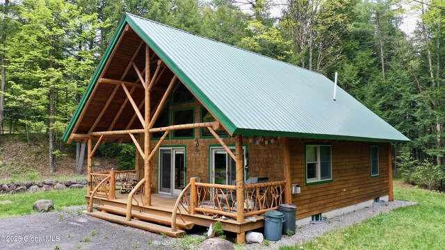 13 Dewey Rd, Chester, NY 12860 - back of house featuring a wooded view, a deck, metal roof, and a standing seam roof