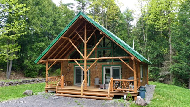 13 Dewey Rd, Chester, NY 12860 - view of front facade featuring a forest view and a deck
