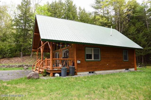 13 Dewey Rd, Chester, NY 12860 - view of front of property with a front yard, metal roof, and view of wooded area