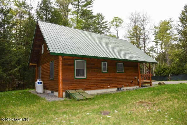 13 Dewey Rd, Chester, NY 12860 - view of home's exterior featuring a lawn and metal roof