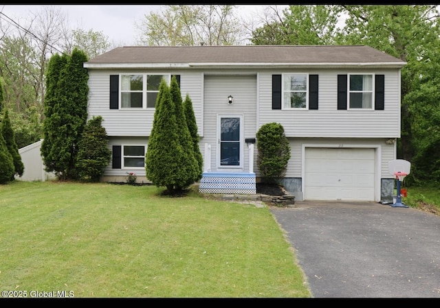29 Clark St, Hudson Falls, NY 12839 - raised ranch featuring asphalt driveway, a front lawn, and an attached garage