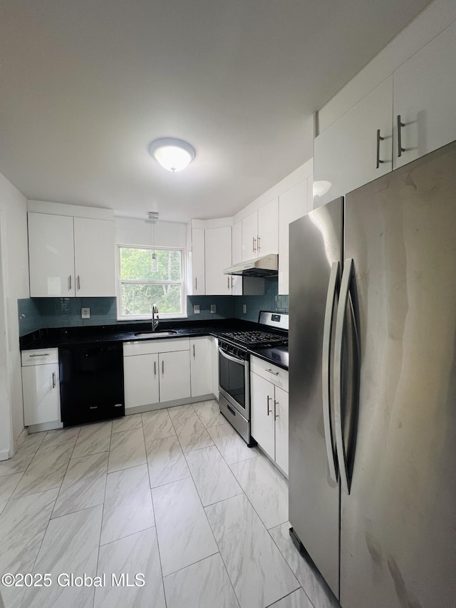 29 Clark St, Hudson Falls, NY 12839 - kitchen with stainless steel appliances, dark countertops, light marble finish flooring, under cabinet range hood, and white cabinetry