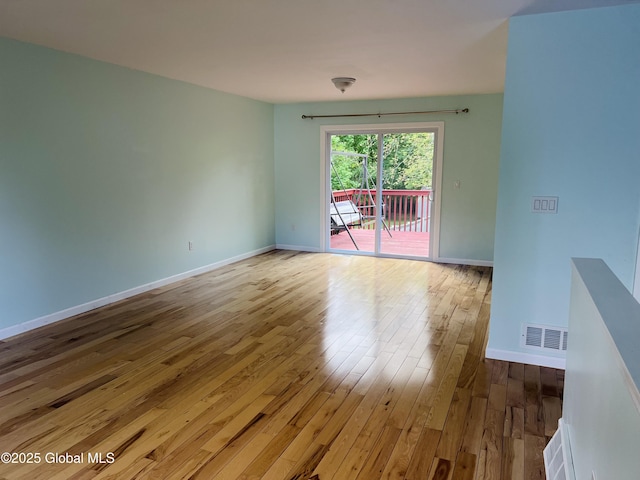 29 Clark St, Hudson Falls, NY 12839 - spare room with hardwood / wood-style flooring and baseboards