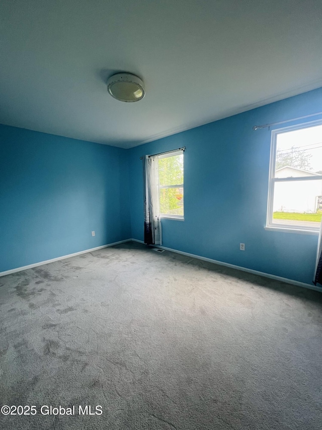 29 Clark St, Hudson Falls, NY 12839 - carpeted spare room featuring baseboards