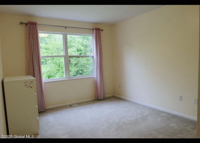 29 Clark St, Hudson Falls, NY 12839 - carpeted spare room featuring healthy amount of natural light and baseboards
