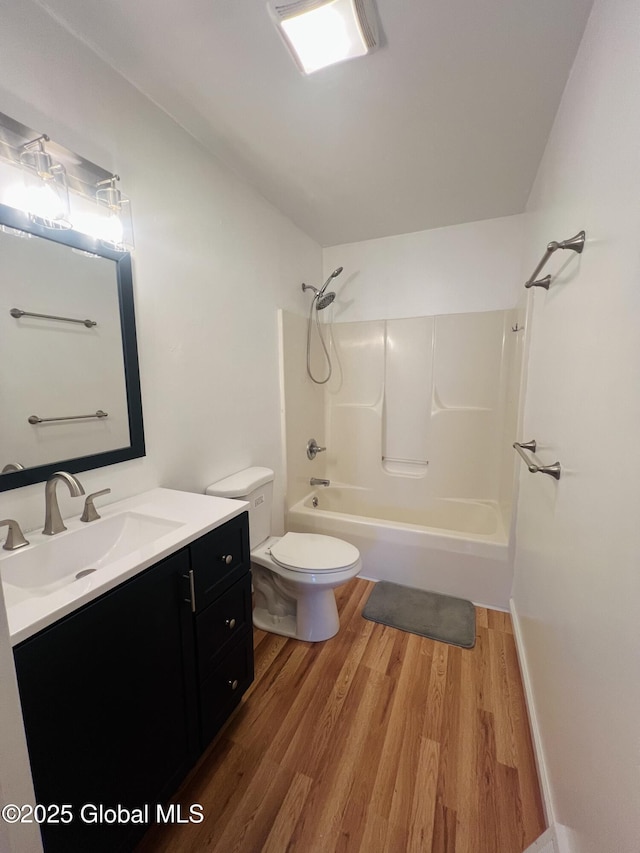 29 Clark St, Hudson Falls, NY 12839 - full bathroom featuring wood finished floors, toilet,  shower combination, and vanity