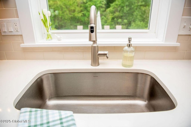 20 Bridgewater Ct, Clifton Park, NY 12065 - kitchen view of a sink, decorative backsplash, and light countertops