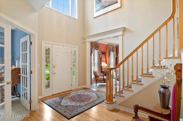71 Hearthstone Dr, Wilton, NY 12831 - entrance foyer with a high ceiling, wood finished floors, and stairs