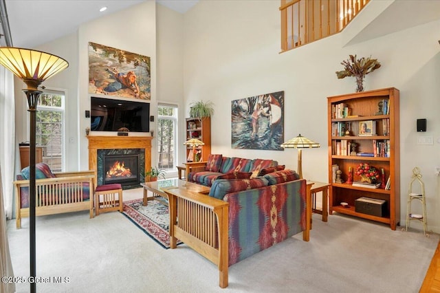 71 Hearthstone Dr, Wilton, NY 12831 - living room with high vaulted ceiling, a premium fireplace, carpet, and baseboards