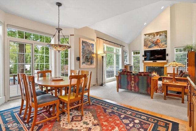 71 Hearthstone Dr, Wilton, NY 12831 - dining room with a warm lit fireplace and high vaulted ceiling