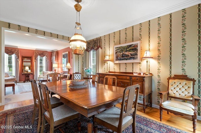 71 Hearthstone Dr, Wilton, NY 12831 - dining area featuring wood finished floors, plenty of natural light, a chandelier, crown molding, and baseboards