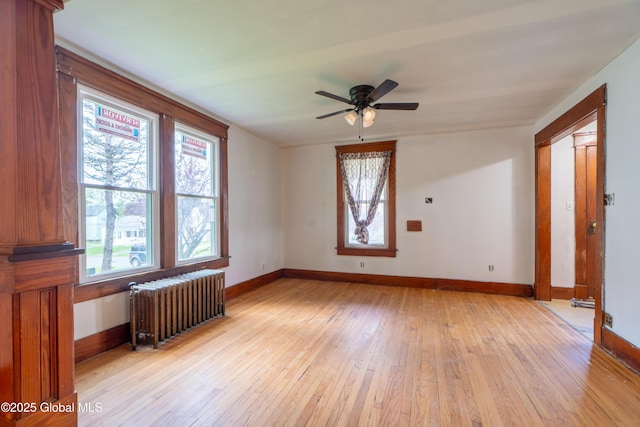 8 Rosewood Ave, Johnstown, NY 12095 - unfurnished room featuring radiator heating unit, plenty of natural light, light wood-style flooring, and a ceiling fan