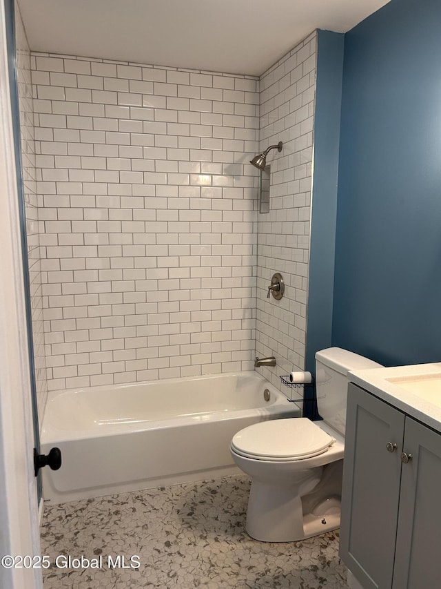 full bathroom featuring toilet, bathtub / shower combination, and vanity