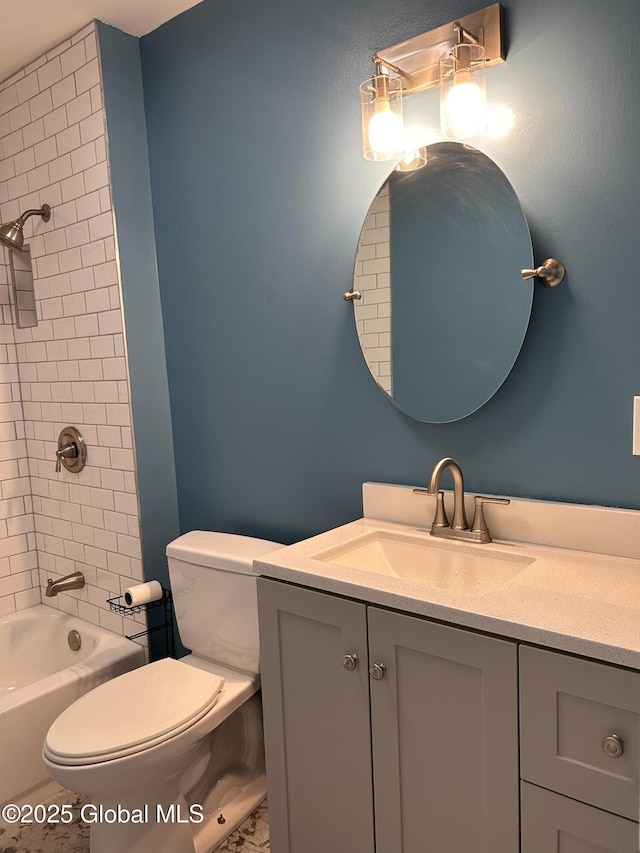 bathroom featuring toilet, vanity, and  shower combination