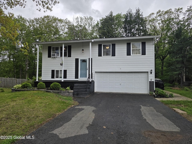 31 Whipple Tree Rd, Milton, NY 12020 - bi-level home featuring asphalt driveway and an attached garage