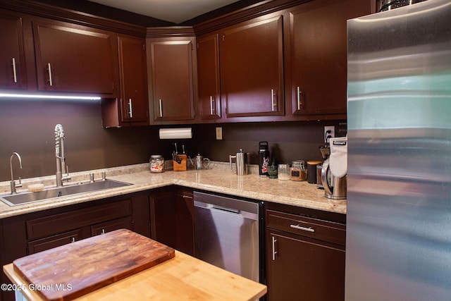 31 Whipple Tree Rd, Milton, NY 12020 - kitchen featuring appliances with stainless steel finishes, a sink, dark brown cabinetry, and light stone counters