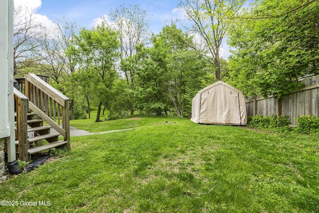 1409 Indian Fields Rd, Bethlehem, NY 12067 - view of yard with stairway, a storage unit, and an outbuilding