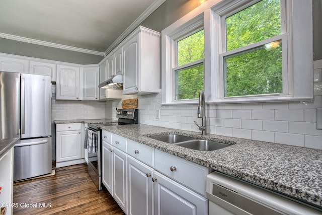 1409 Indian Fields Rd, Bethlehem, NY 12067 - kitchen with stainless steel appliances, a sink, crown molding, white cabinetry, and tasteful backsplash