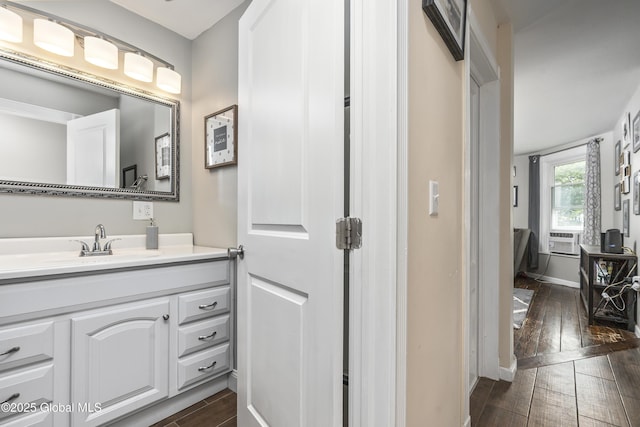 1409 Indian Fields Rd, Bethlehem, NY 12067 - bathroom with wood finished floors, vanity, baseboards, and cooling unit