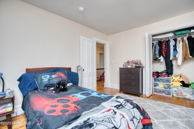 1409 Indian Fields Rd, Bethlehem, NY 12067 - bedroom featuring wood finished floors, a closet, and baseboards