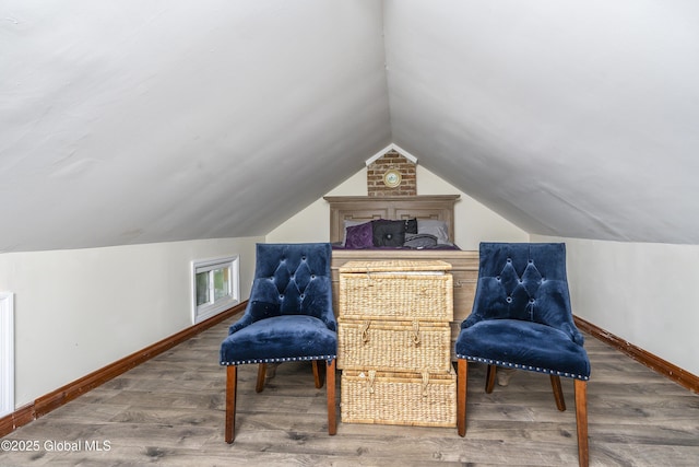 1409 Indian Fields Rd, Bethlehem, NY 12067 - sitting room with wood finished floors, baseboards, and vaulted ceiling