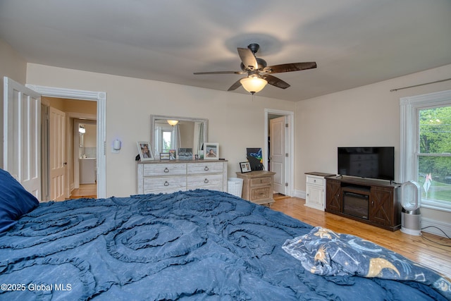 1409 Indian Fields Rd, Bethlehem, NY 12067 - bedroom with wood finished floors, a ceiling fan, and baseboards