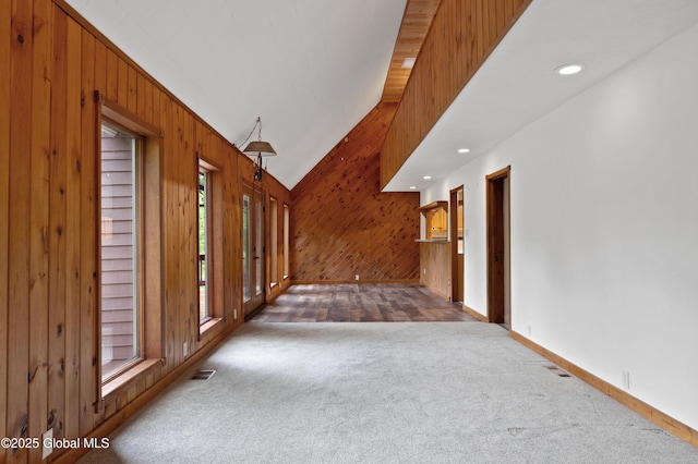 401 Wilton Gansevoort Rd, Wilton, NY 12831 - carpeted entryway featuring wood walls, healthy amount of natural light, lofted ceiling, and baseboards