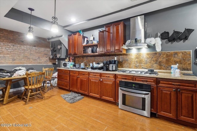 57 O Connell St, Albany, NY 12209 - kitchen with appliances with stainless steel finishes, wall chimney exhaust hood, backsplash, and light countertops