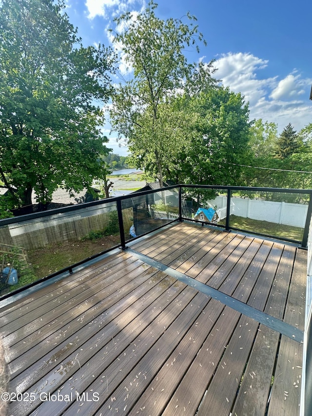 wooden deck featuring a water view
