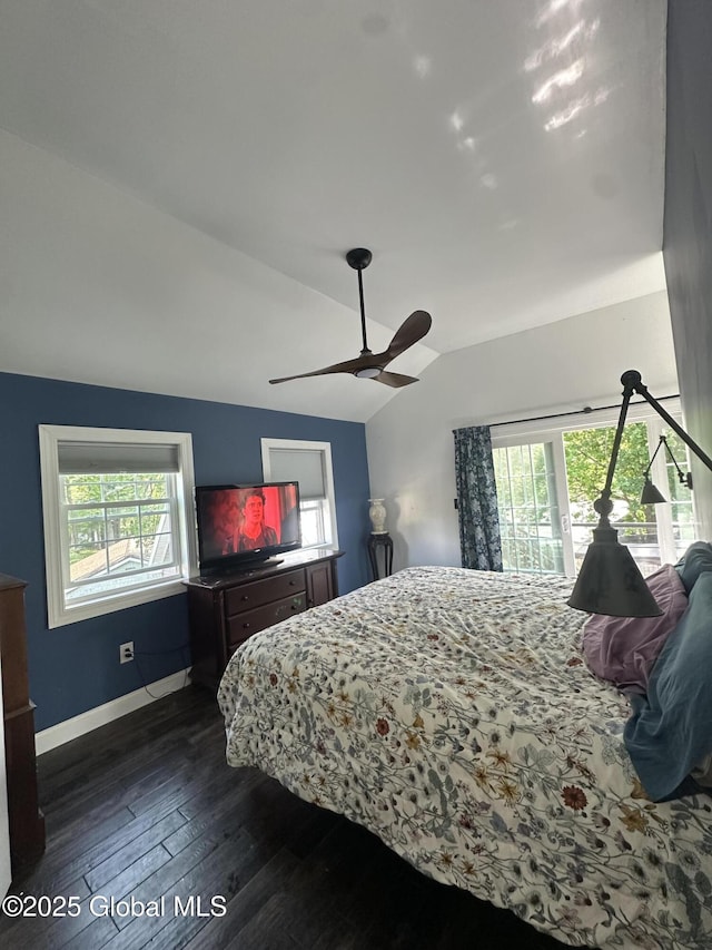 bedroom featuring vaulted ceiling, dark wood-style flooring, baseboards, and ceiling fan