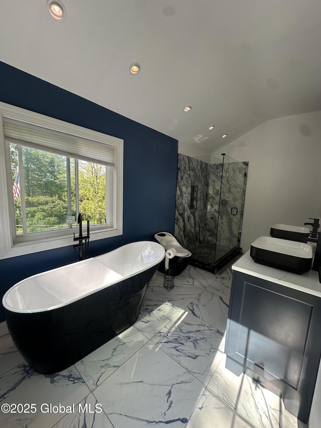 full bath with vaulted ceiling, recessed lighting, marble finish flooring, a marble finish shower, and a freestanding bath